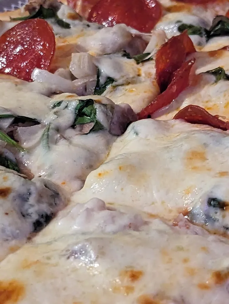 Sausage Mushroom Spinach Pepperoni and Onions Pizza